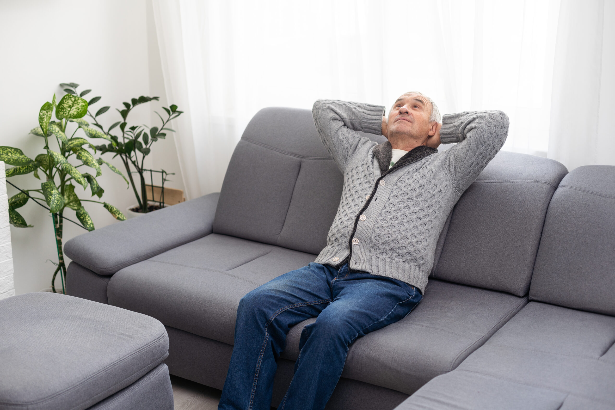 thinking senior man on a white background